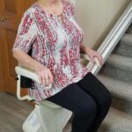 Woman riding stair lift
